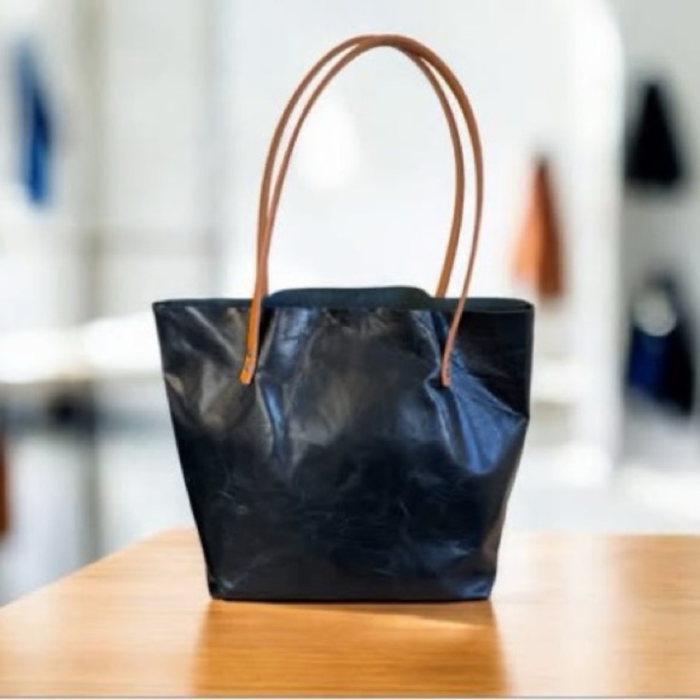 Sleek Black Tote with Tan Shoulder Straps